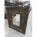 Rectangular mirror in decorative floral frame