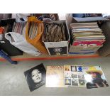3 boxes and 2 bags containing vinyl records
