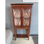 Late Victorian double door china cabinet with shelf under