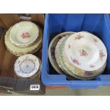 2 boxes containing rose patterned crockery