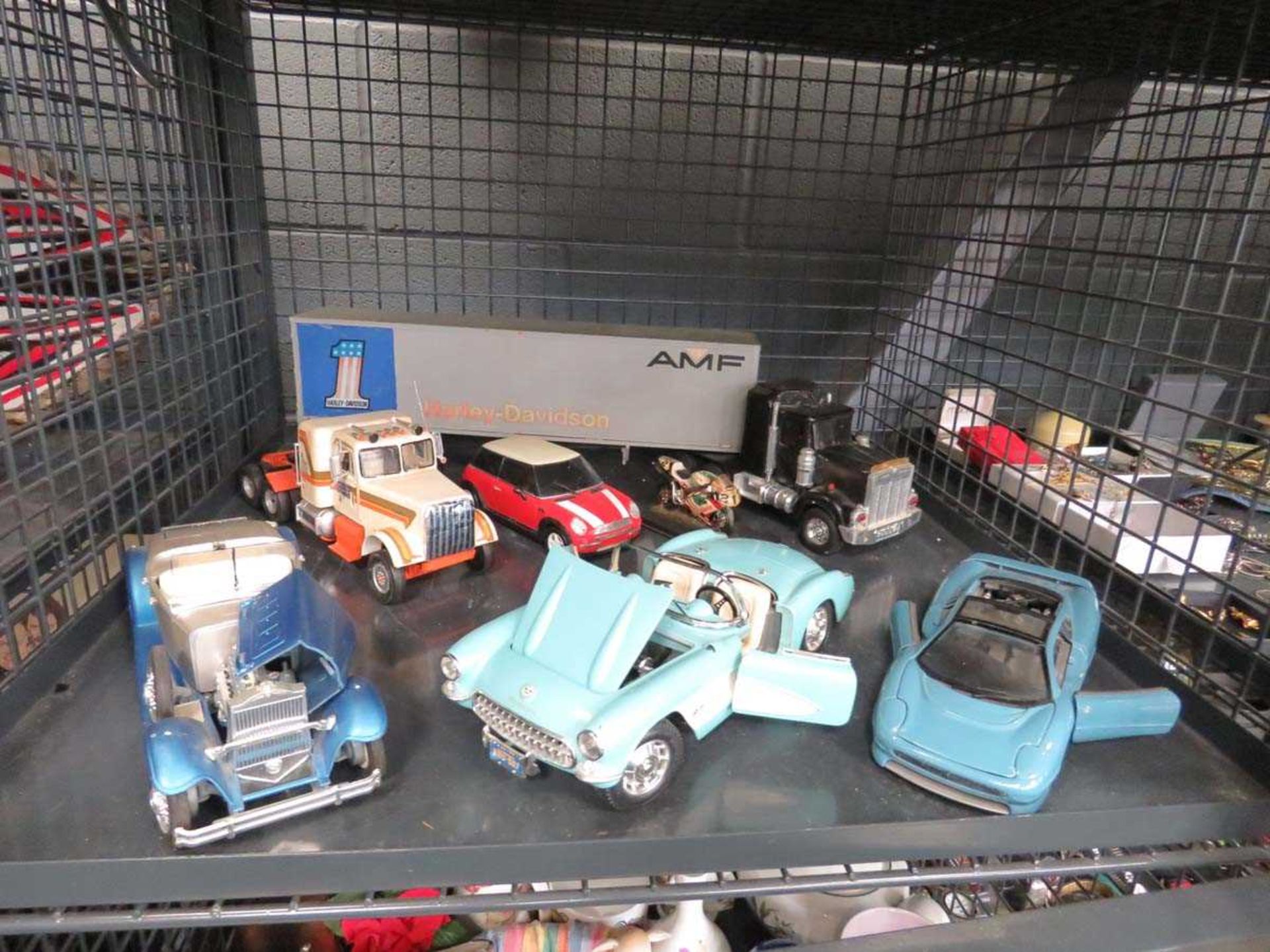 Cage containing a quantity of toy cars