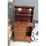 Mahogany music cabinet with open fronted shelving over