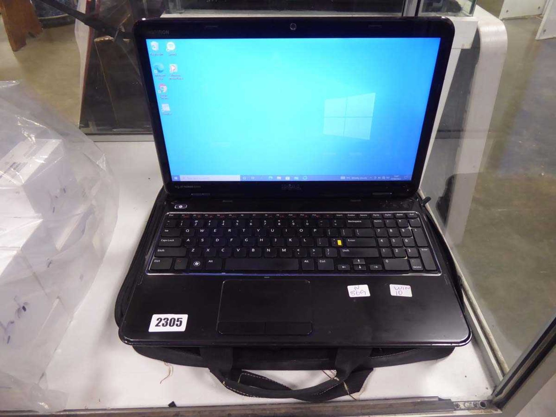 Dell Inspiron laptop running Windows 10 with case