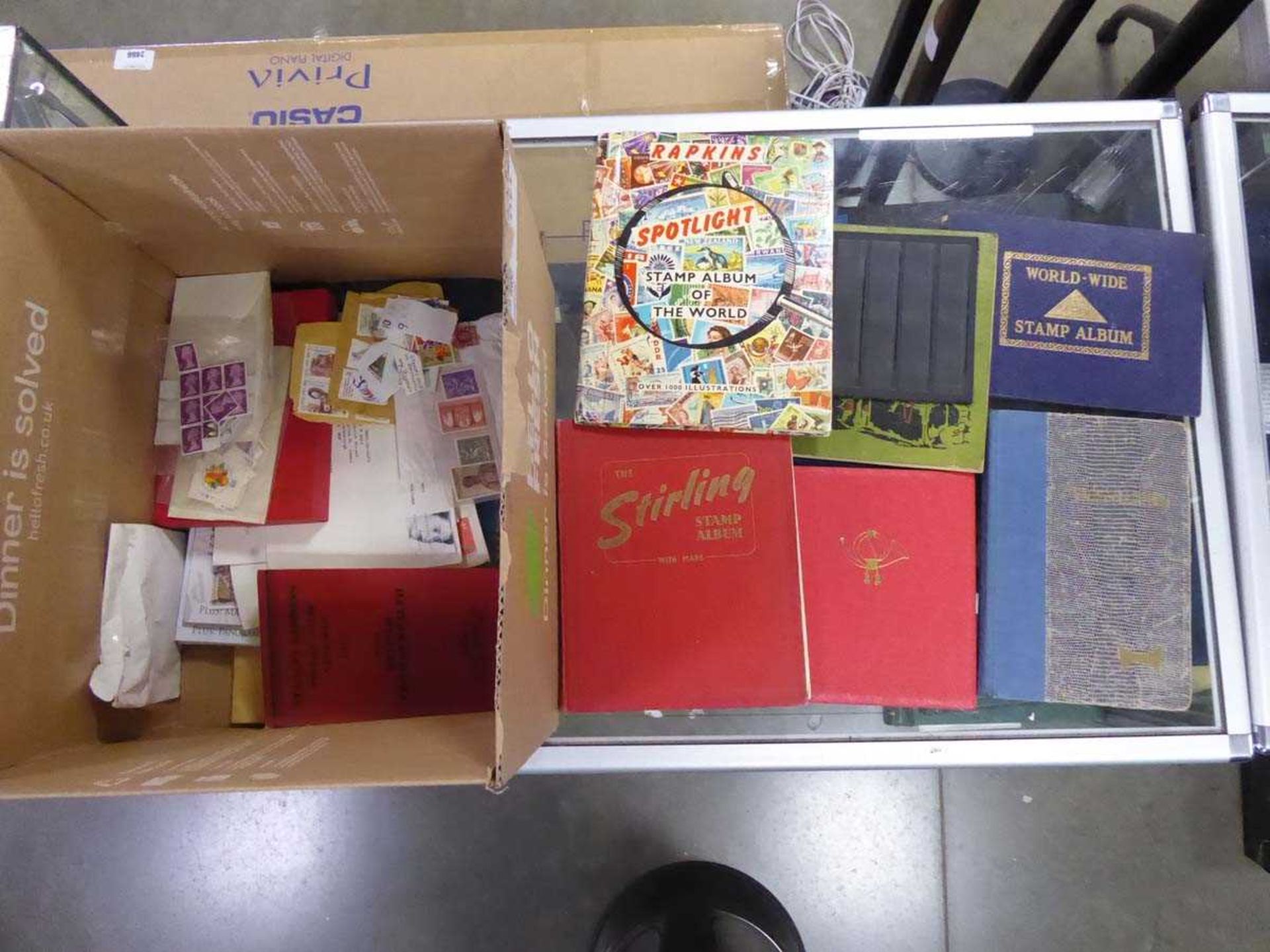 Box containing various stamp albums with various worldwide stamps including a German stockbook album