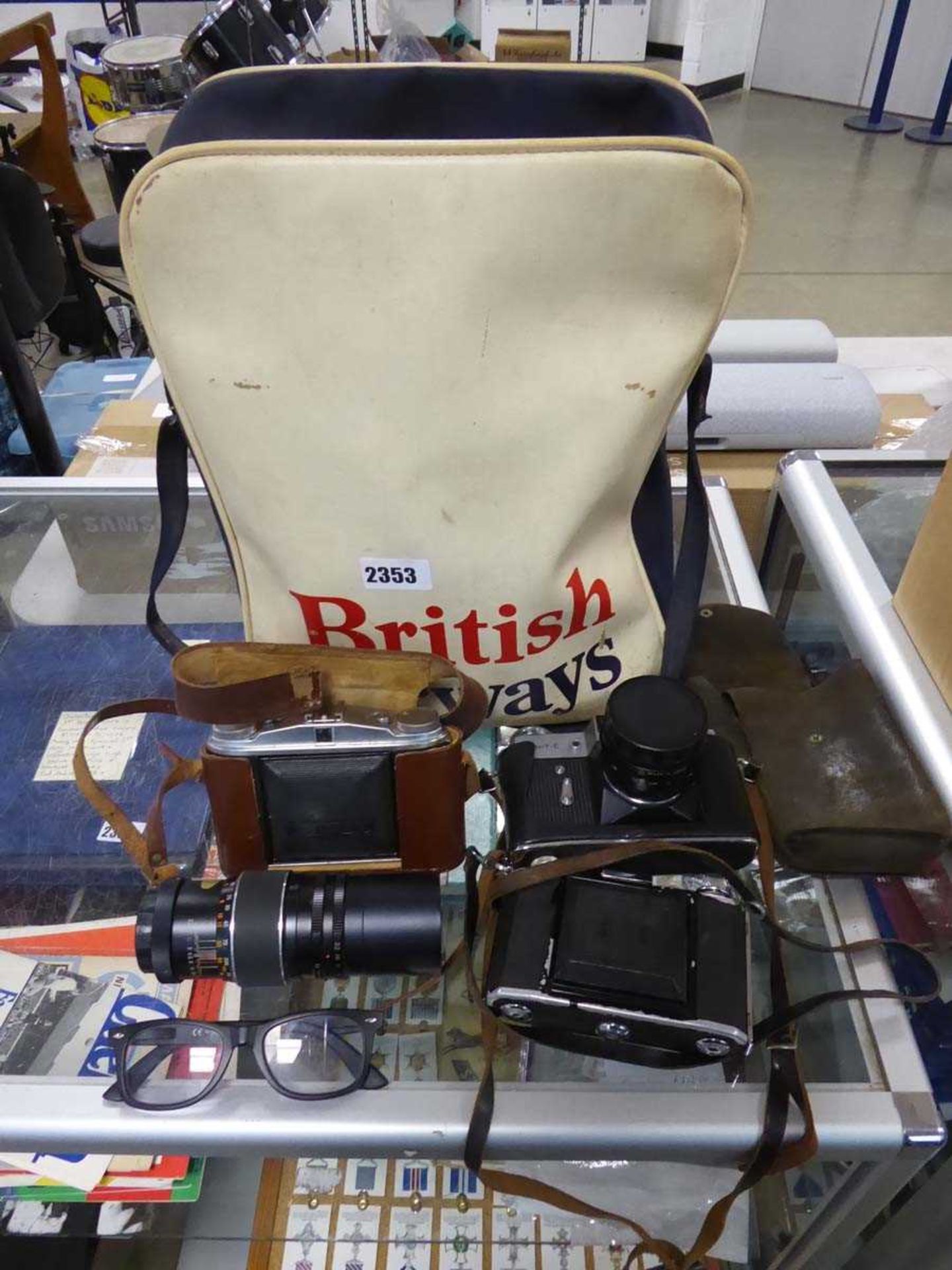 British Airways vintage bag with various film camera equipment which includes a Zenit camera