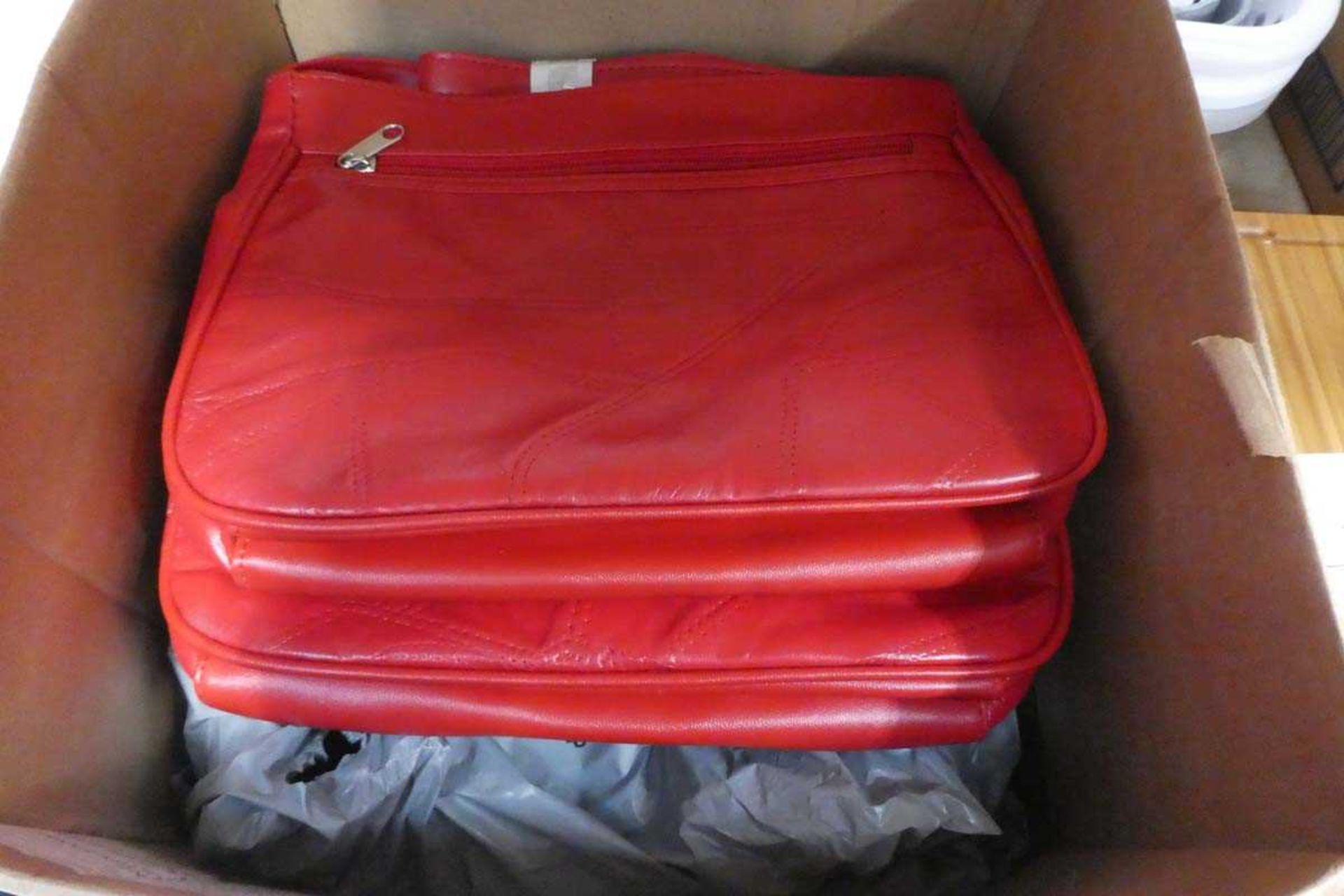 +VAT Box containing red handbags
