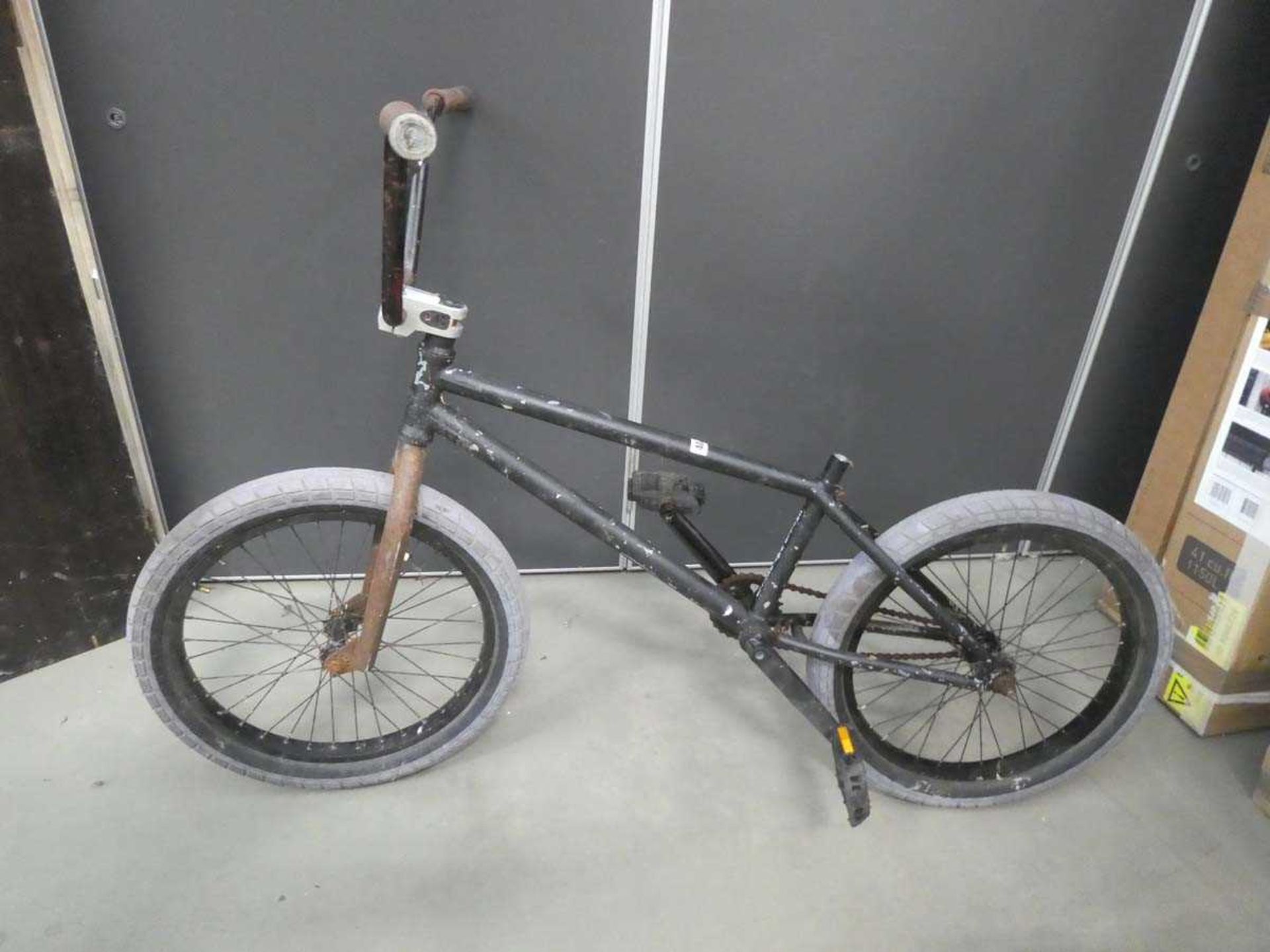 Black BMX cycle, lacking saddle