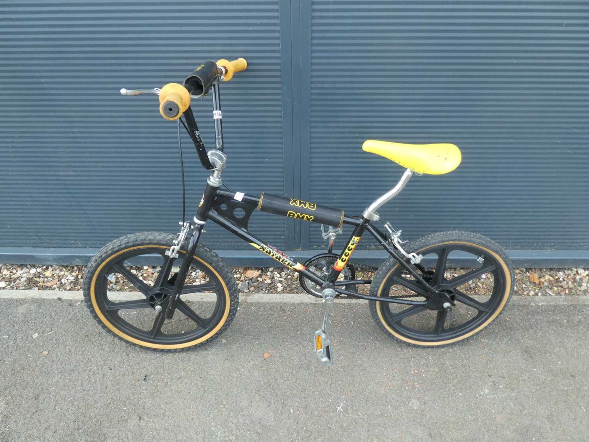 Black and yellow BMX style cycle