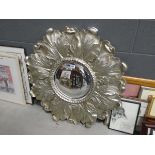 Circular mirror in flower patterned frame