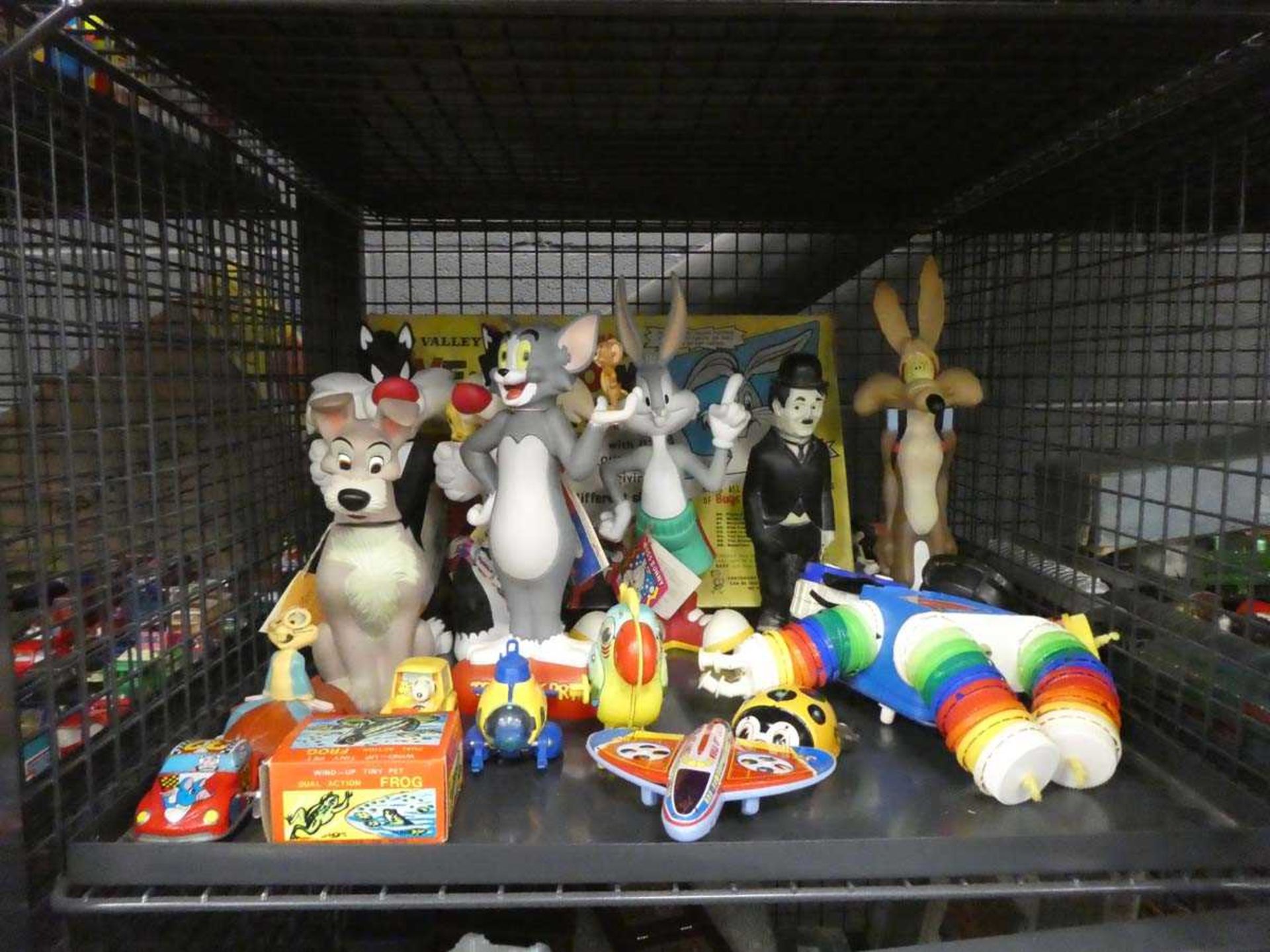 Cage containing Bugs Bunny and other figures plus wind up toys and Charlie Chaplin figure