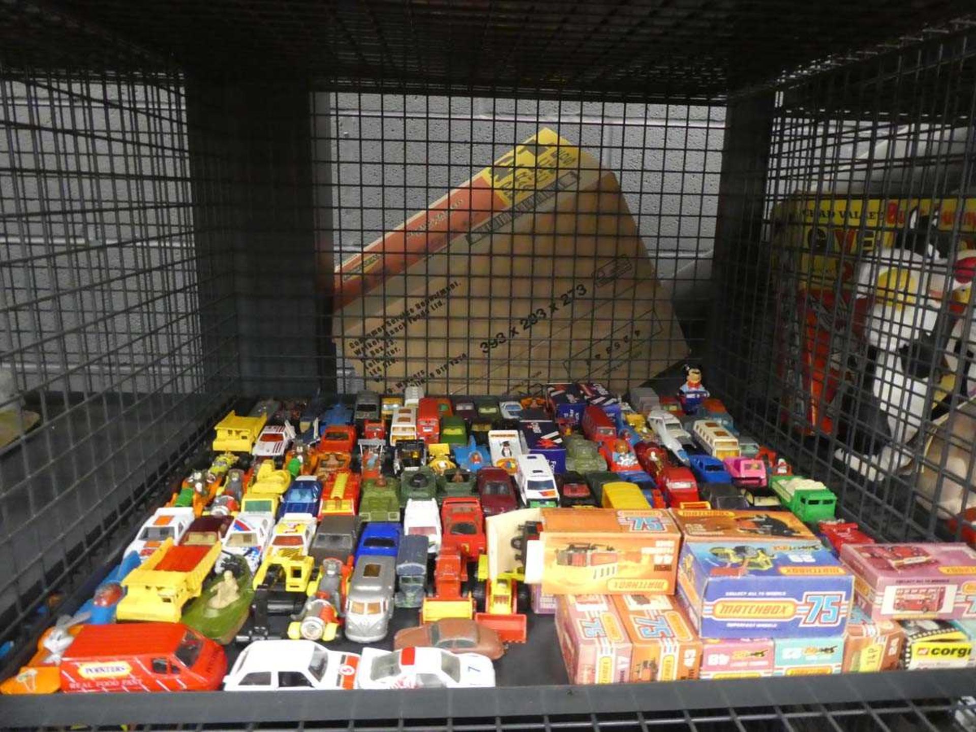 Cage containing boxed Matchbox and loose diecast cars