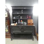 Black stained kitchen dresser with shelves and doors under