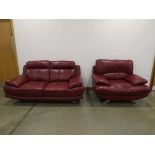 Red 2 seater sofa in leatherette on chrome base with matching armchair