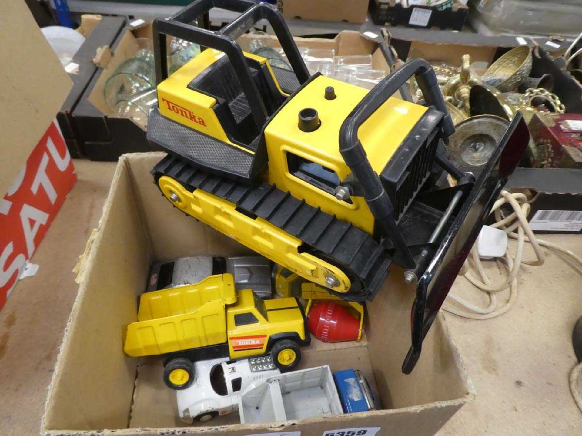 Box containing Tonka toys