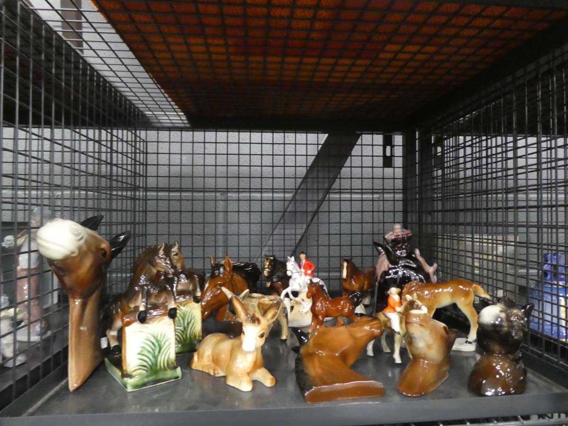 Cage containing a large quantity of Cooper Craft and other horse figures