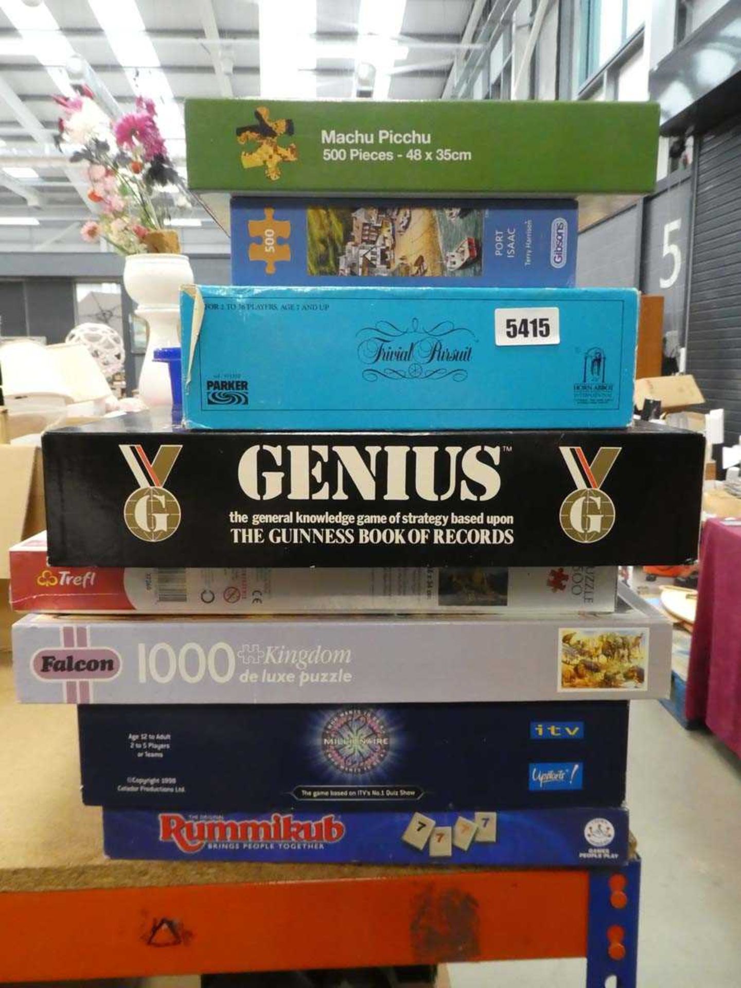 Stack of jigsaw puzzles and board games
