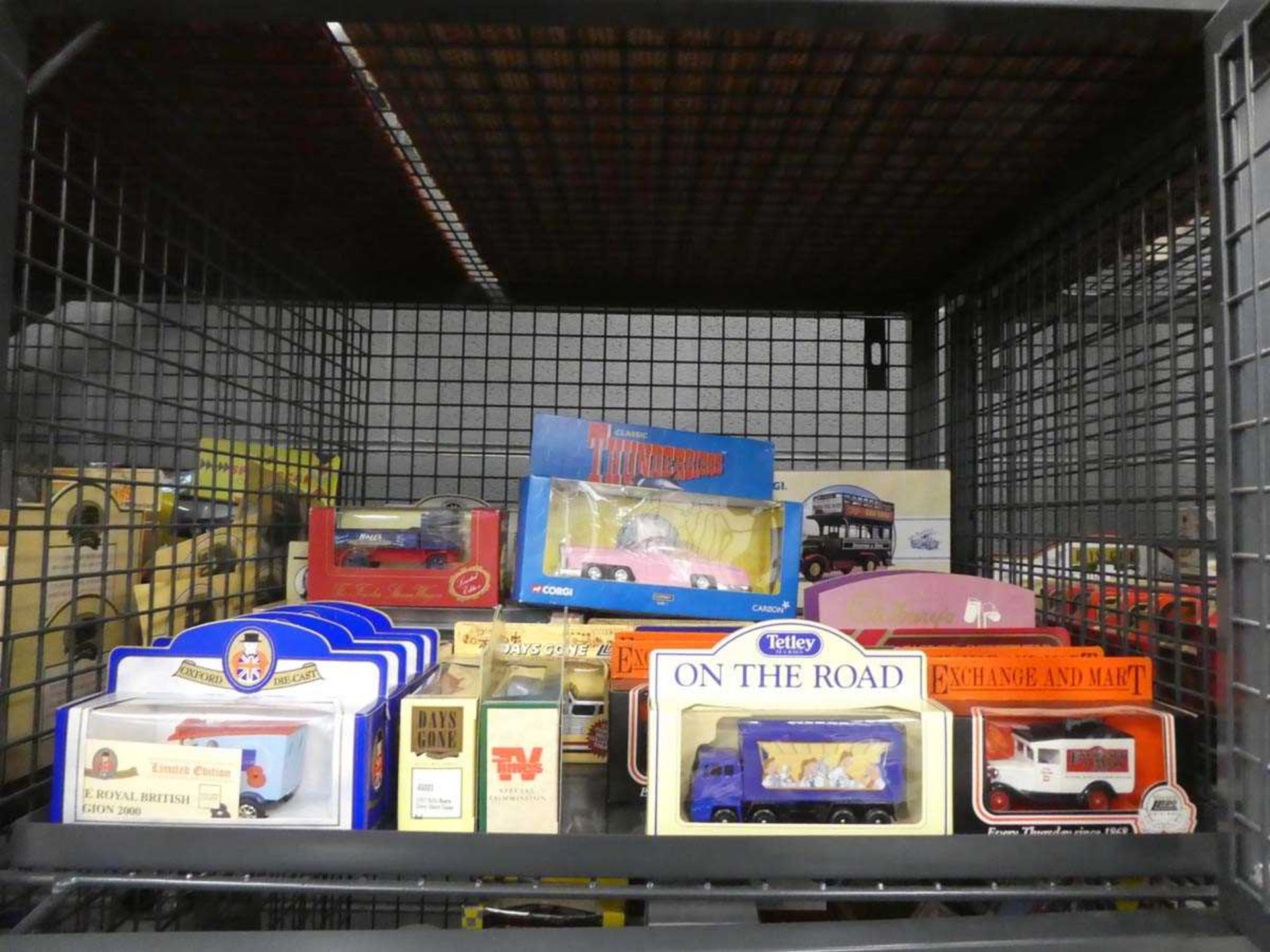 Cage containing a large quantity of Matchbox and other cars
