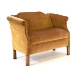 An upholstered sofa of small proportions with mahogany square legs, w. 111 cmh. 81 cm, d. 58 cm,