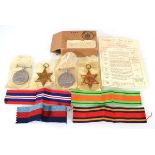 A set of four Second World War medals including War & Defence, 1939-1945 & Burma Stars, in a OHMS