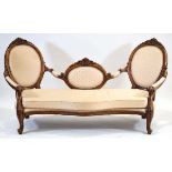 A Victorian-type moulded double chaise with cream upholstery