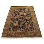 A Louis de Poortere woollen rug, the central ground depicting a Persian hunting scene, within