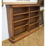 A Victorian oak double bookcase with eight adjustable shelves on a plinth base, w. 187 cmSides cut-