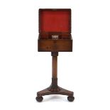 A 19th century mahogany teapoy, the beaded surface enclosing two detachable cannisters and a