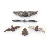 A silver and enamelled RAF sweetheart's brooch, a RAFVR badge, two further RAF brooches and a USAF