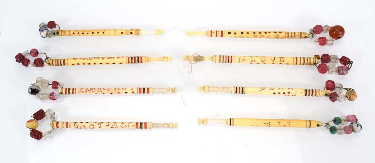 A group of eight bone message bobbins inscribed 'I Love Jesus', 'Love Me Dearly', 'My Dear