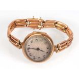 An early 20th century ladies 9ct rose gold wristwatch, the circular silvered dial with black