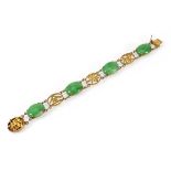 A Chinese export yellow metal bracelet set four oval cabochon green stones, l. 16 cm, 13.3 gmsStones