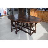 An 18th century style oak gateleg 'wake' table, 229 x 151 cm