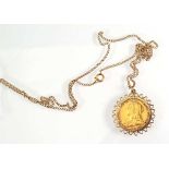 A 9ct yellow gold fine curblink necklace suspending a Victorian sovereign, Melbourne mint, dated