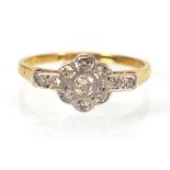 An early 20th century 18ct yellow gold and platinum highlighted cluster ring set small diamonds in