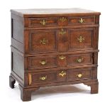 A late 17th/early 18th century oak chest, the four graduated drawers and geometric beading on