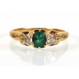 A yellow metal ring set emerald cut emerald and two old cut diamonds,ring size K,2.7 gmsWell worn