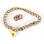 A 9ct yellow gold curblink bracelet with heart shaped padlock clasp, together with a small section