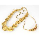 A Trifari gold plated necklace of articulated leaf design and another necklace by Trifari set