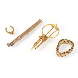 A small group of yellow gold items comprising a 9ct propelling pencil, a 9ct horseshoe charm, a 10ct