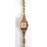 A ladies 9ct yellow gold wristwatch by Benson, the square dial with gold coloured Arabic numerals on