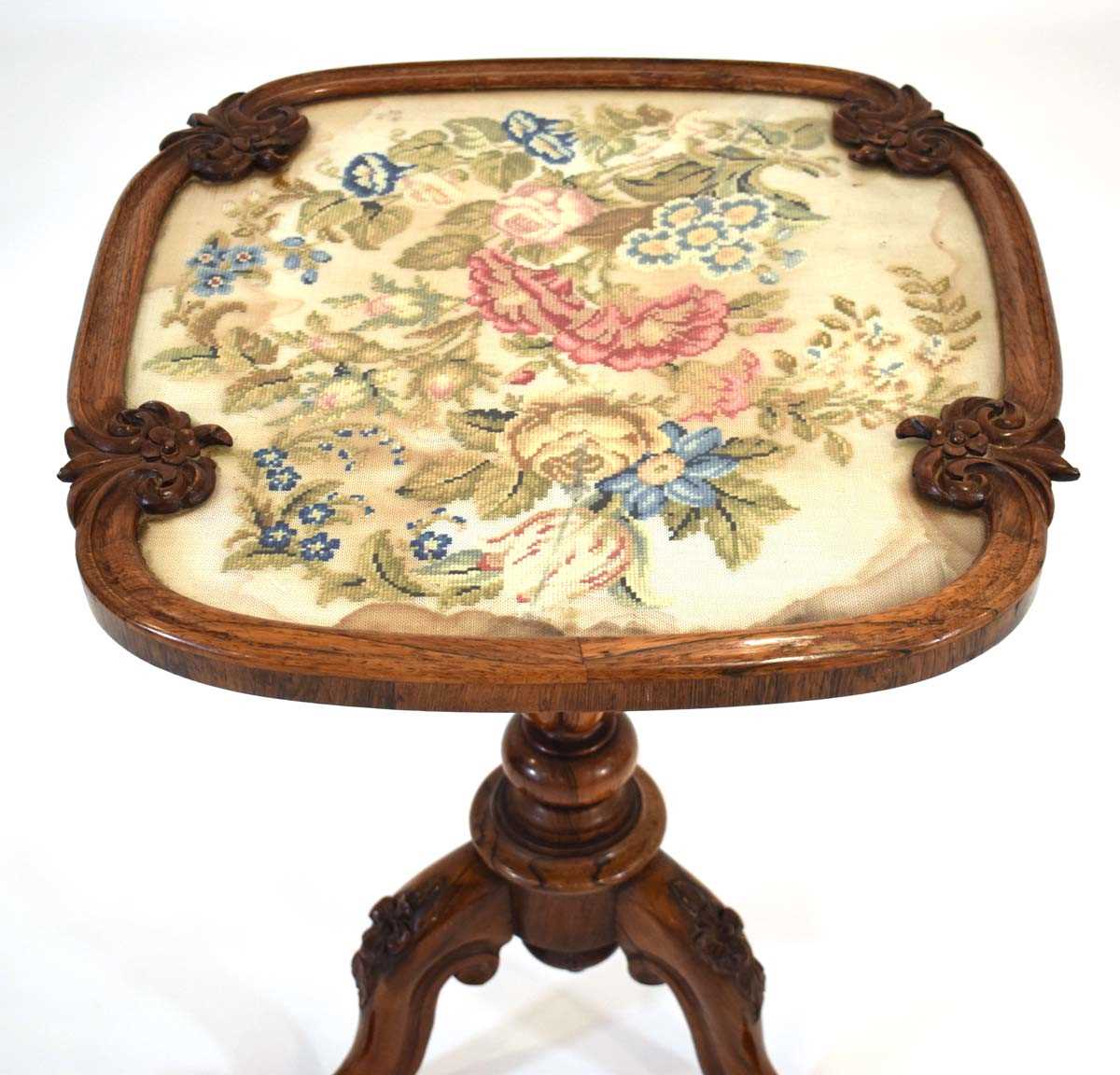 A 19th century rosewood occasional table with an embroidered surface on a turned column and three - Image 3 of 3