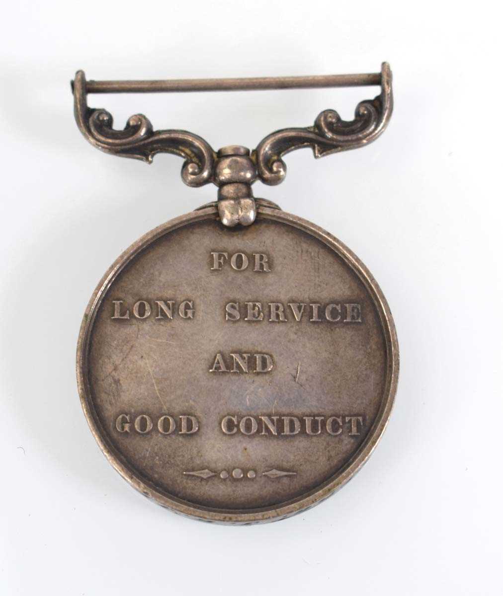 A Victorian Army 'Long Service & Good Conduct' Medal awarded to 1479 1st Cls Sergt J.G. Jebb C&T C. - Image 2 of 2