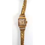 A ladies 18ct yellow gold wristwatch by Marxo, the square silvered dial with gold coloured Arabic