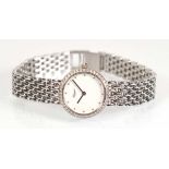 A ladies 18ct white gold wristwatch by Chopard, the circular white dial with diamond markers