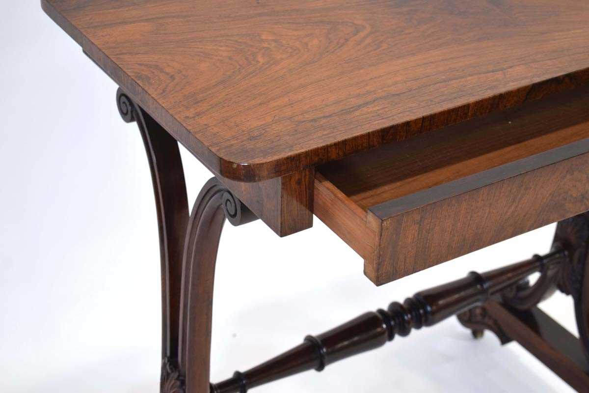 A mid-19th century rosewood side table with a single frieze drawer, scrolled supports and castors, - Image 4 of 4