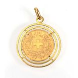 An 18ct yellow gold pendant suspending a Swiss 20 franc coin dated 1915, overall 9.9 gms