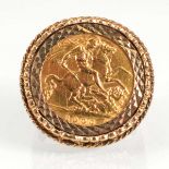 A 9ct yellow gold ring set an Edwardian half sovereign dated 1906 in a loose mount, overall 10