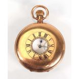 A gold plated half hunter pocket watch by Waltham, the white enamel dial with black Arabic