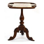 A 19th century rosewood occasional table with an embroidered surface on a turned column and three
