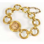 A ladies 18ct yellow gold cocktail wristwatch by Bueche Girod, the circular dial with black Roman